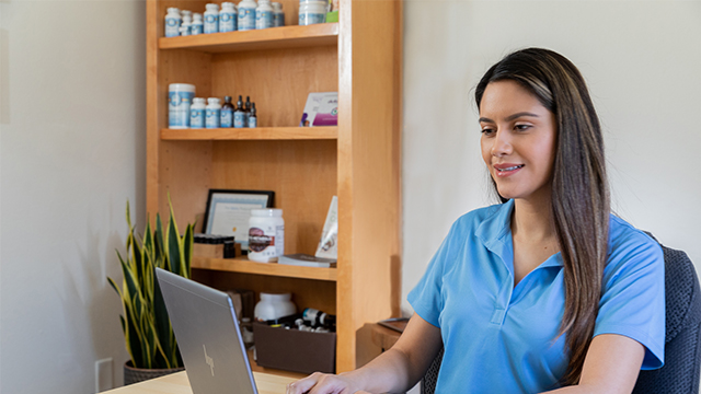 A chiropractic looks up credentials of a potential employee.